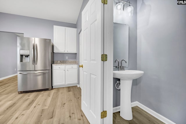 bathroom with sink and hardwood / wood-style floors