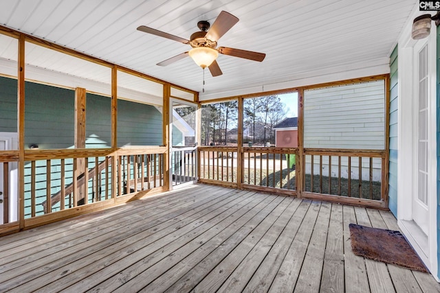 wooden deck featuring ceiling fan