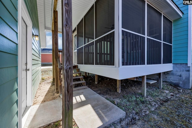 view of side of property featuring a sunroom