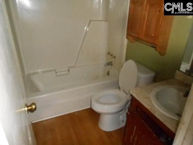 full bathroom featuring shower / bath combination, vanity, wood-type flooring, and toilet