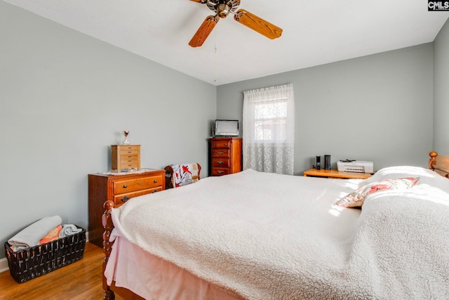 bedroom with ceiling fan and light wood-type flooring