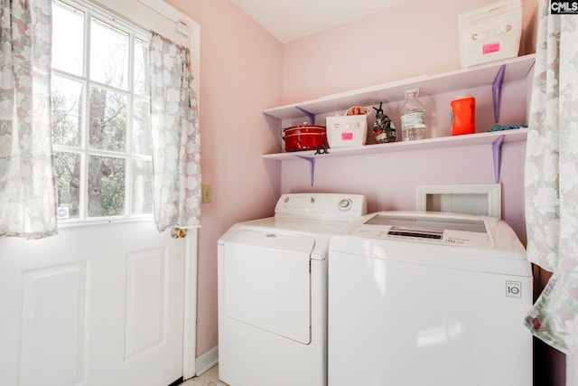 washroom featuring washing machine and clothes dryer