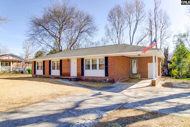 ranch-style house with a carport