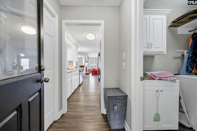 laundry room featuring dark wood-type flooring