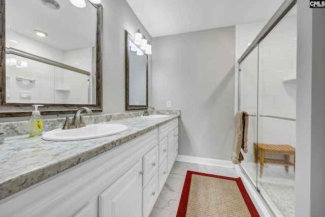 bathroom with vanity and a shower with shower door