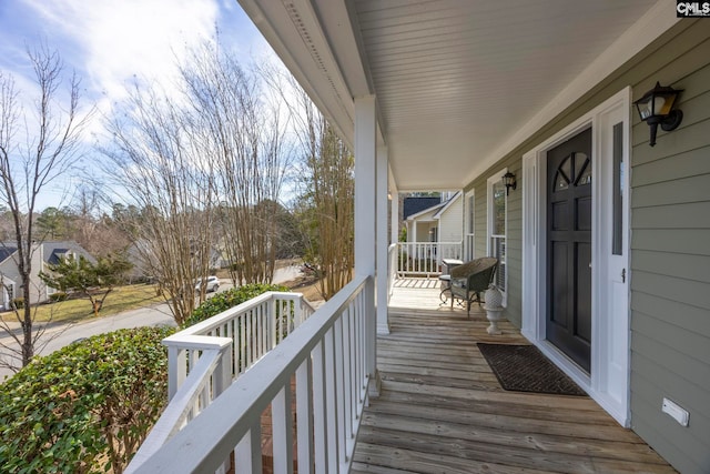 wooden terrace featuring covered porch