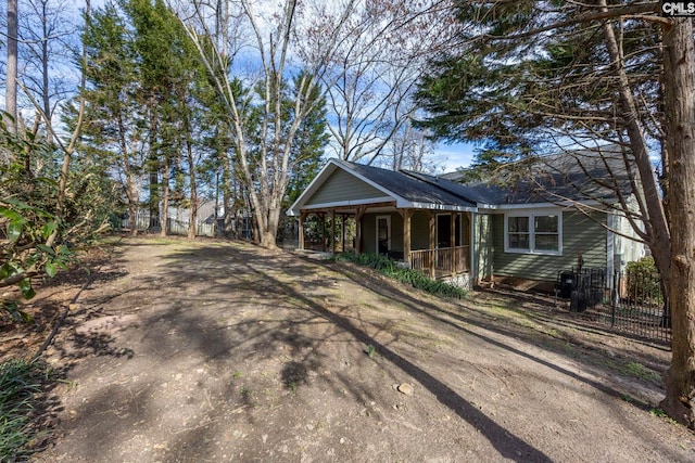 view of property exterior with covered porch