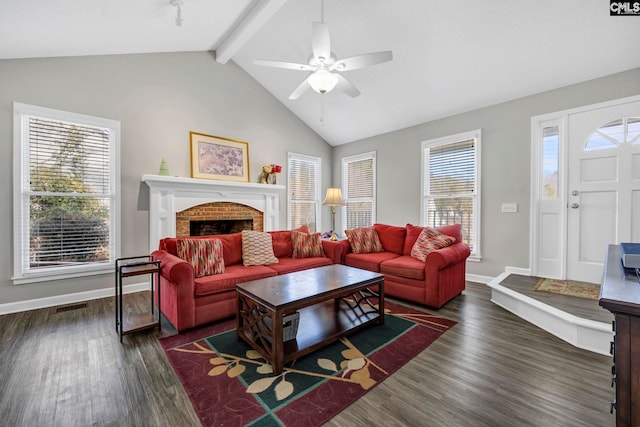 living room with a fireplace, dark wood-type flooring, lofted ceiling with beams, and ceiling fan