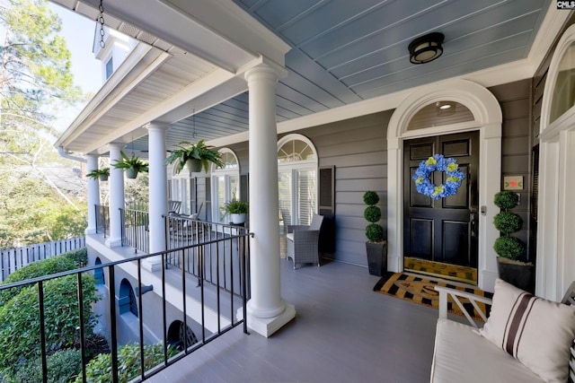 property entrance with covered porch