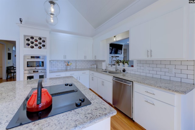 kitchen with white cabinetry, sink, and appliances with stainless steel finishes