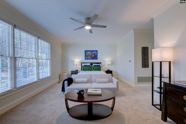 carpeted living room featuring ornamental molding and ceiling fan