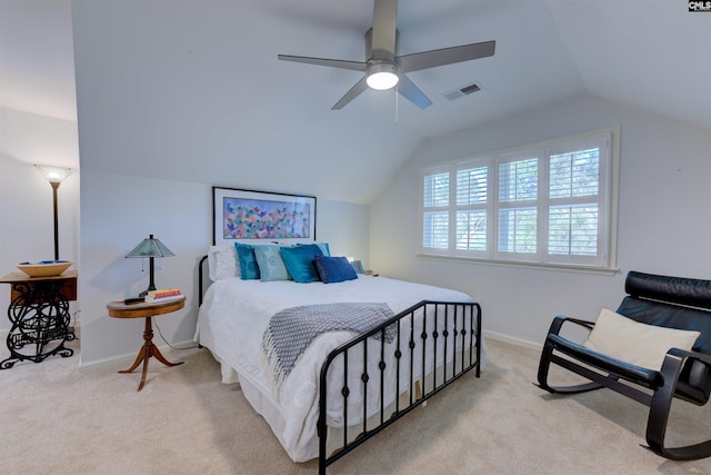 bedroom featuring light carpet, vaulted ceiling, and ceiling fan