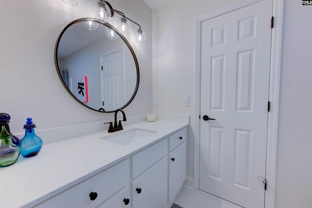 bathroom featuring tile patterned flooring and vanity