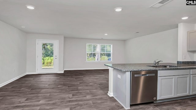 kitchen featuring stainless steel dishwasher, dark hardwood / wood-style floors, sink, and gray cabinetry