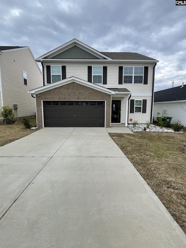 front facade featuring a garage and a front lawn