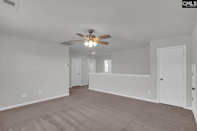 carpeted spare room with ceiling fan