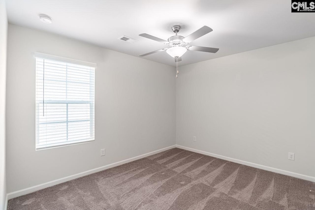 carpeted empty room featuring ceiling fan