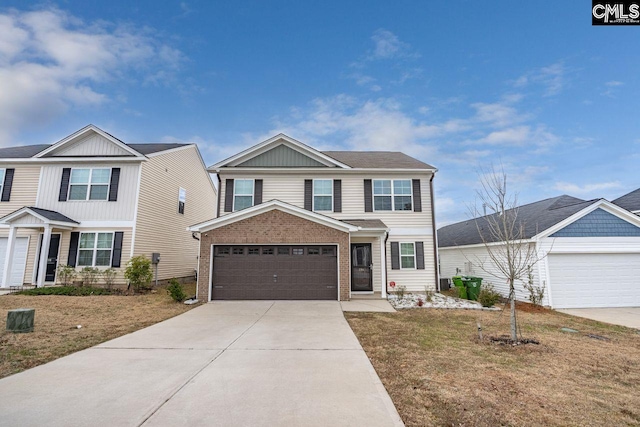 view of front of house featuring a garage and a front lawn