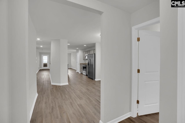 hallway featuring light wood-type flooring