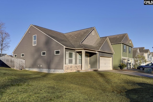 view of front facade featuring a garage and a front lawn