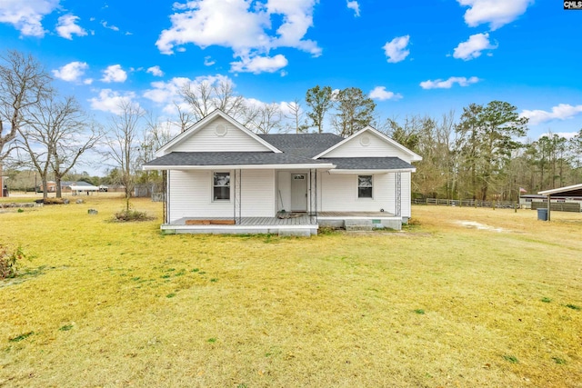 view of front of house with a porch and a front yard