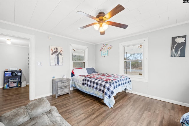 bedroom featuring wood-type flooring, ceiling fan, and crown molding