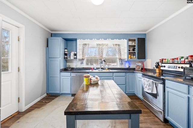 kitchen with stainless steel appliances, dark hardwood / wood-style floors, blue cabinets, and butcher block countertops