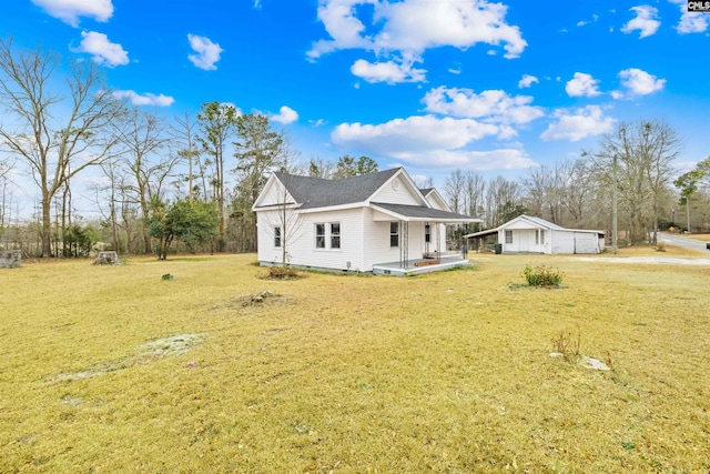 view of front facade with a front yard and a porch