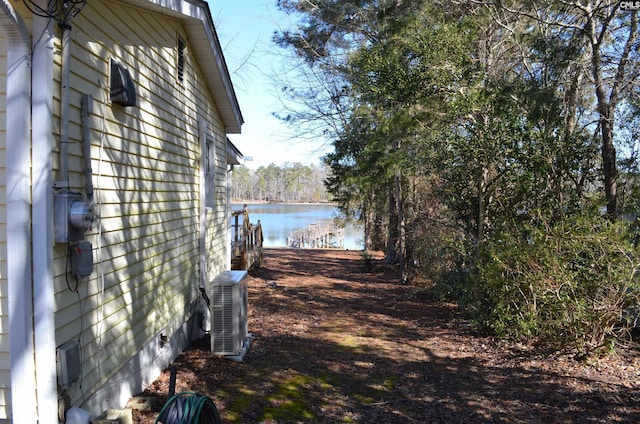 view of side of property with a water view