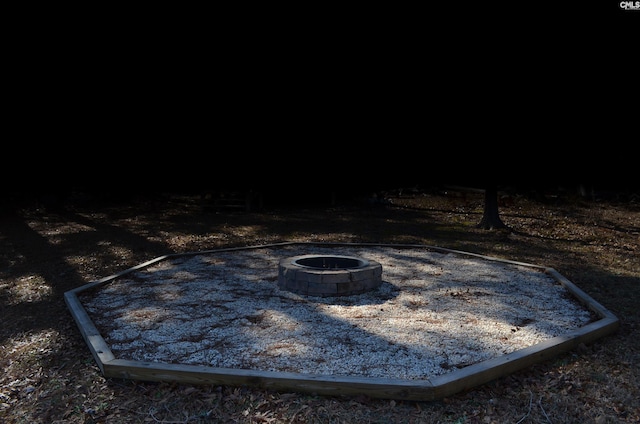 exterior details with an outdoor fire pit