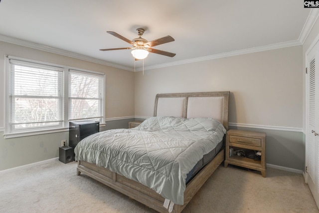 bedroom with ceiling fan, ornamental molding, and light carpet