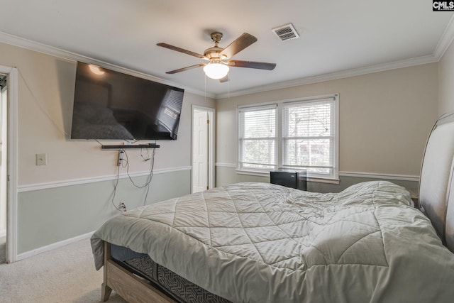 bedroom featuring crown molding, carpet floors, and ceiling fan