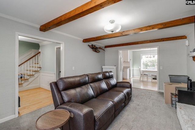 living room with crown molding, light carpet, a notable chandelier, and beam ceiling