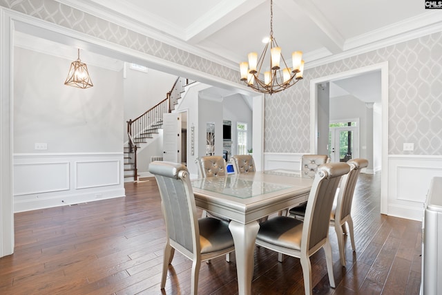 dining area with dark hardwood / wood-style flooring, ornamental molding, a notable chandelier, and beam ceiling