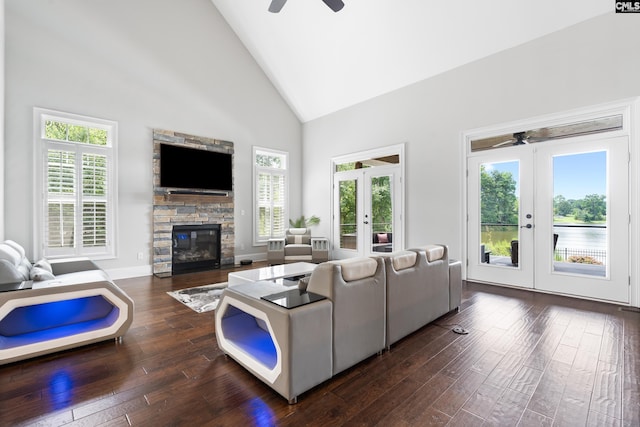 living room featuring french doors, high vaulted ceiling, dark wood-type flooring, and a wealth of natural light