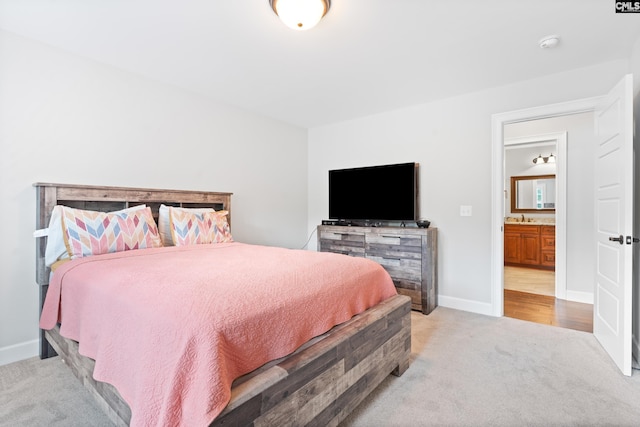 carpeted bedroom with sink