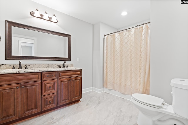 full bathroom featuring vanity, shower / bath combo, and toilet