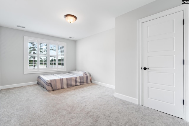 unfurnished bedroom with carpet flooring