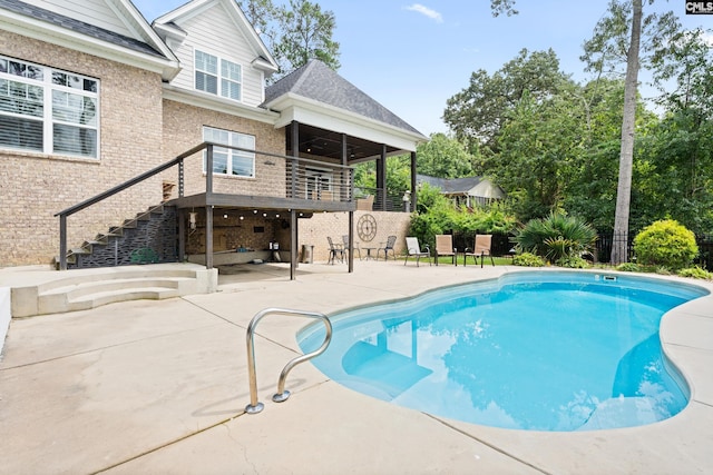 view of swimming pool featuring a patio