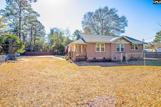 view of side of home featuring a yard