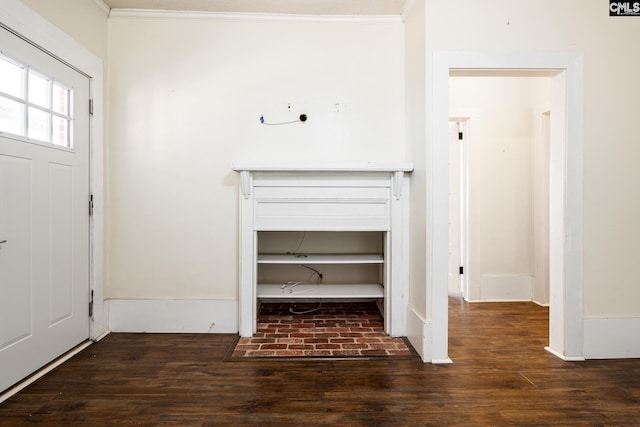 entryway with dark hardwood / wood-style flooring and ornamental molding