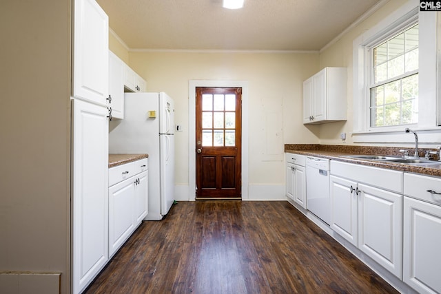 kitchen featuring dark hardwood / wood-style floors, sink, white cabinets, crown molding, and white appliances