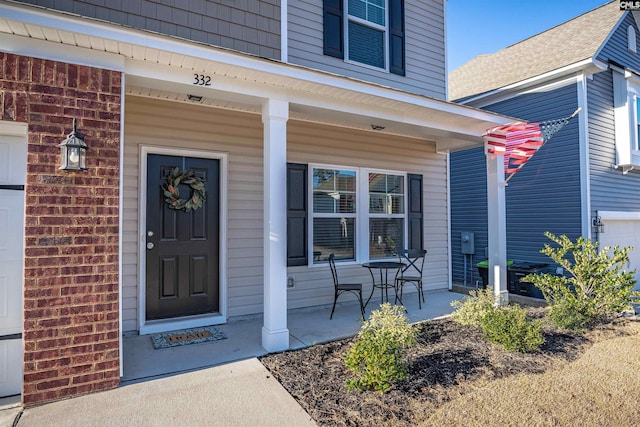 entrance to property featuring covered porch