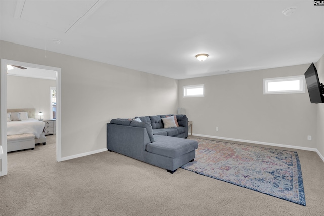 carpeted living room featuring plenty of natural light