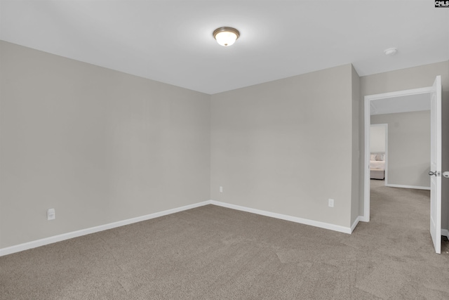 empty room featuring light colored carpet