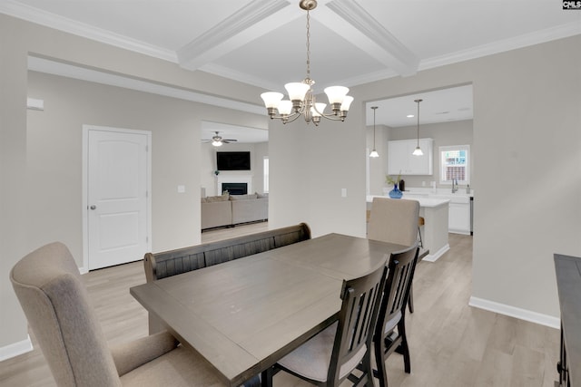 dining room with crown molding, light wood-type flooring, and beam ceiling