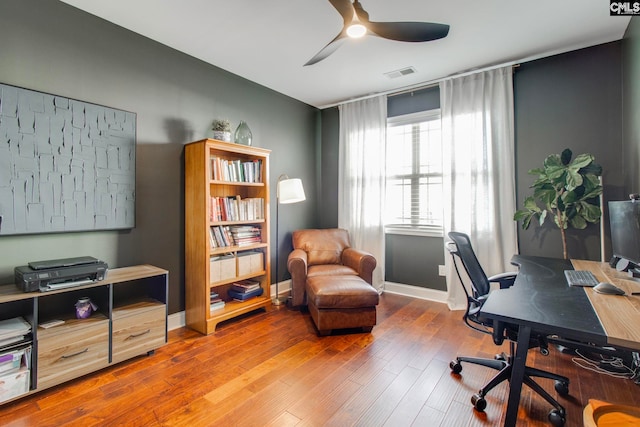 home office featuring hardwood / wood-style flooring and ceiling fan