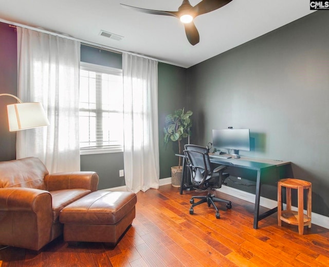 office space with hardwood / wood-style floors and ceiling fan