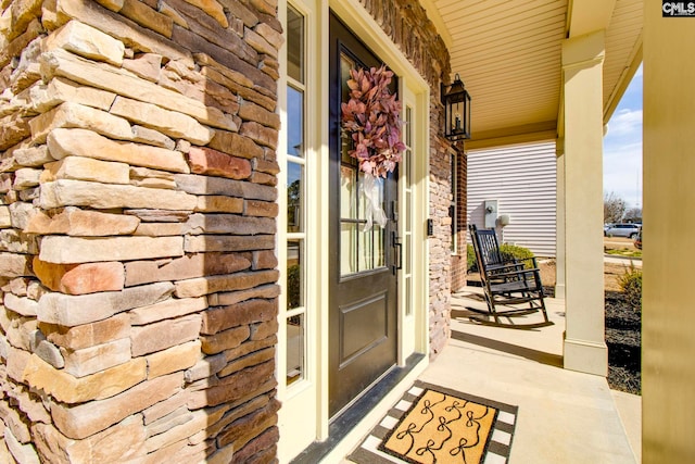 property entrance with covered porch