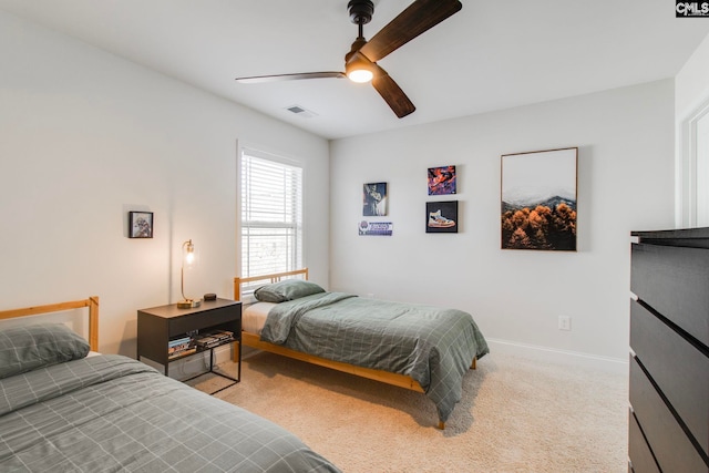 bedroom with light carpet and ceiling fan